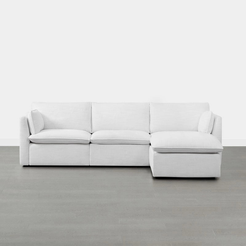 Divano componibile a L con penisola/pouf in crema/bianco, 4 pezzi, 4 posti