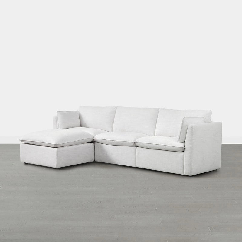 Divano componibile a L con penisola/pouf in crema/bianco, 4 pezzi, 4 posti