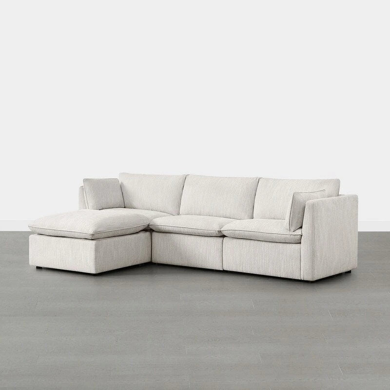Divano componibile a L con penisola/pouf in crema/bianco, 4 pezzi, 4 posti